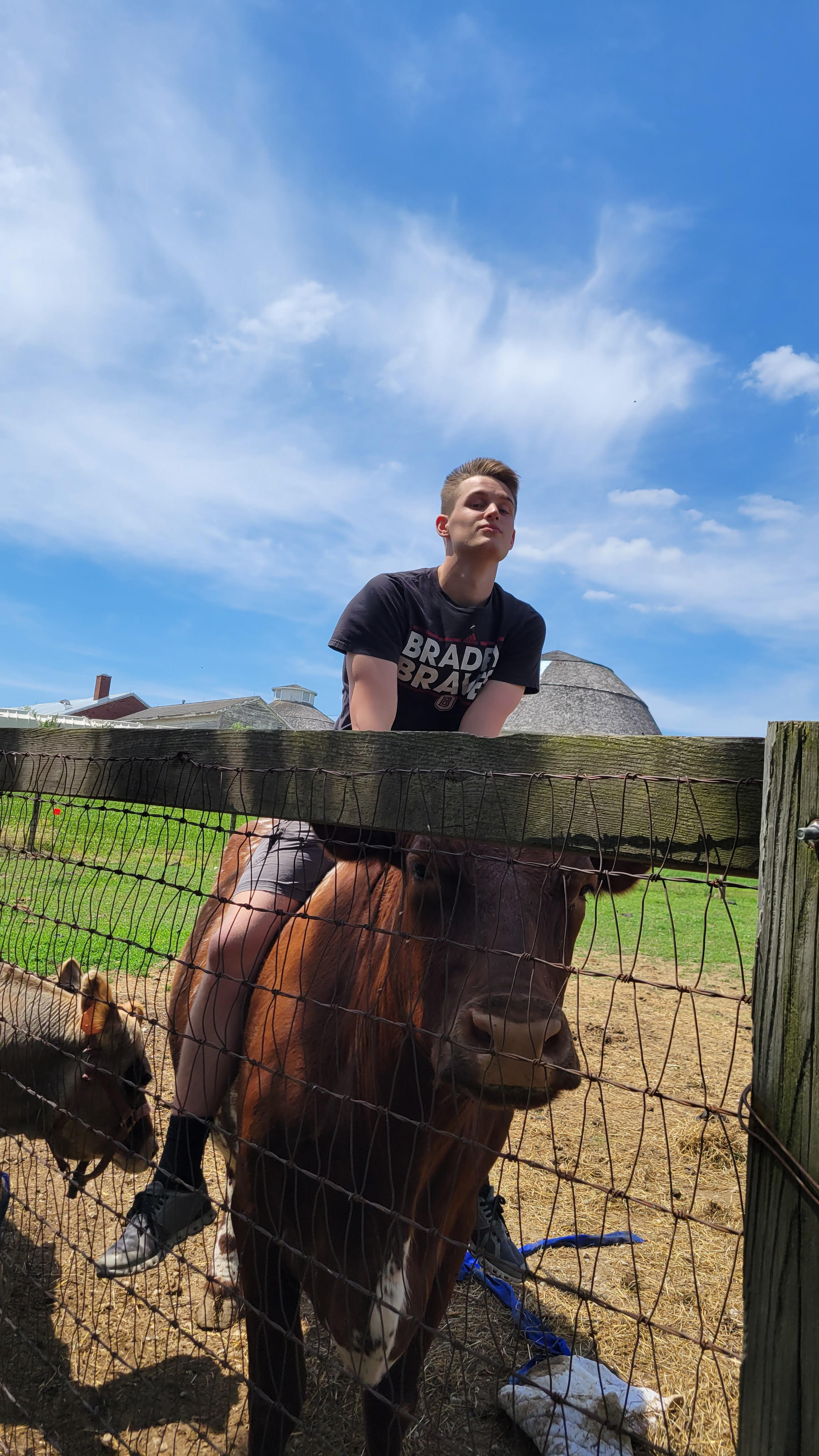 Aaron Calhoun holding a bottle in front of a nuclide chart
